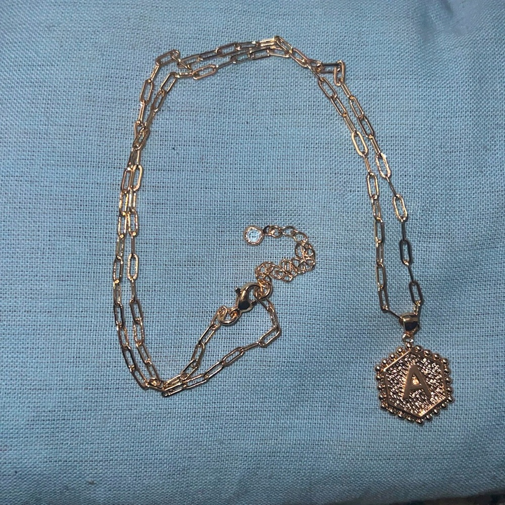 This is a gold A initial necklace.
